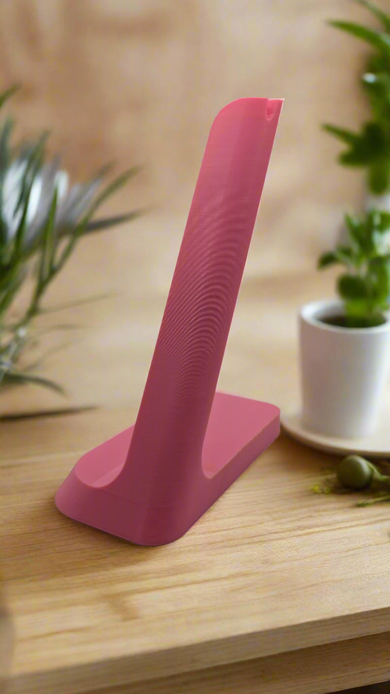 Pink headphone charging stand