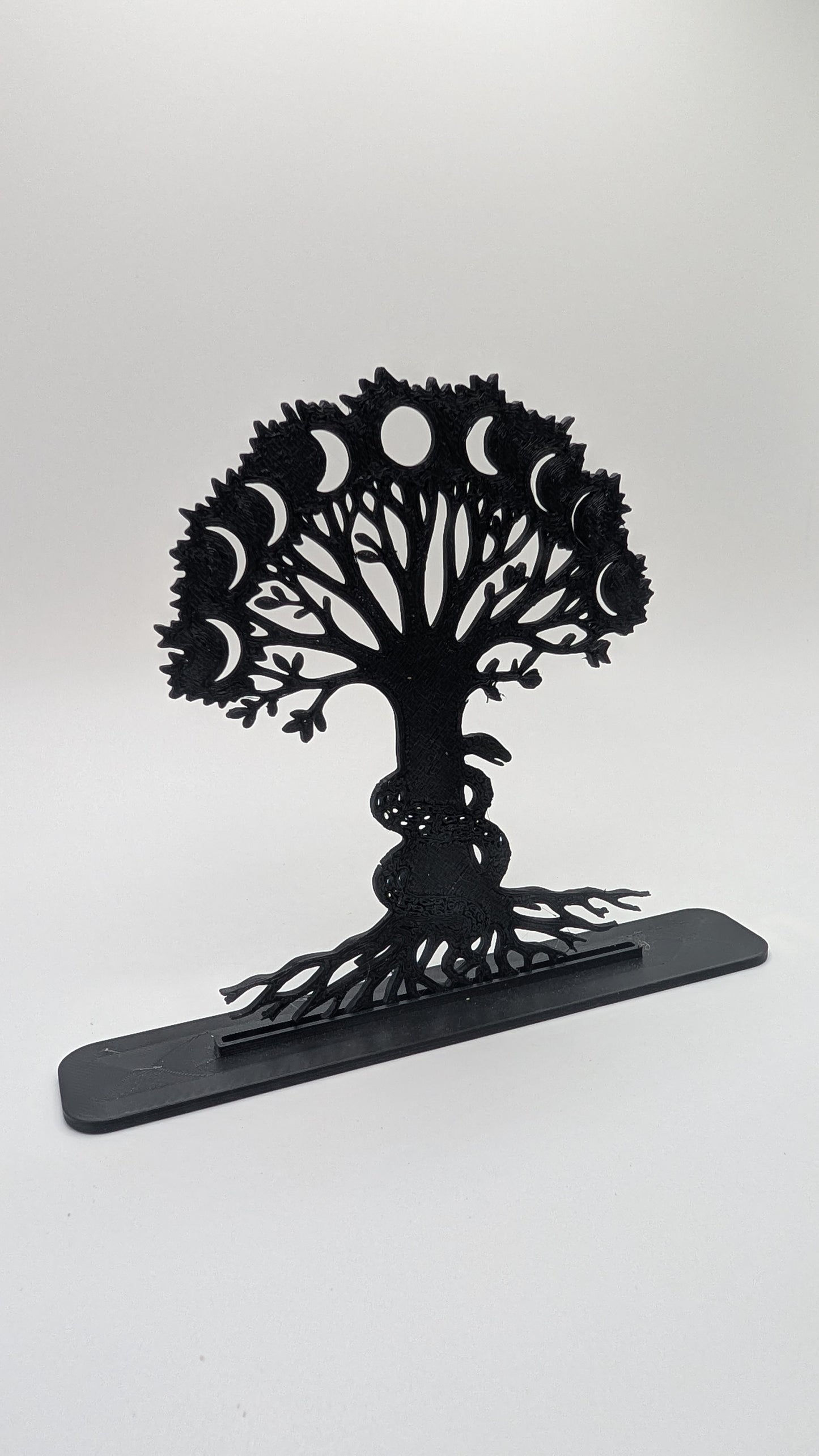 Symbolic Tree of Life desktop statue with detailed roots, lunar phases, and serpent entwined around trunk, ideal for meditation or pagan decor
