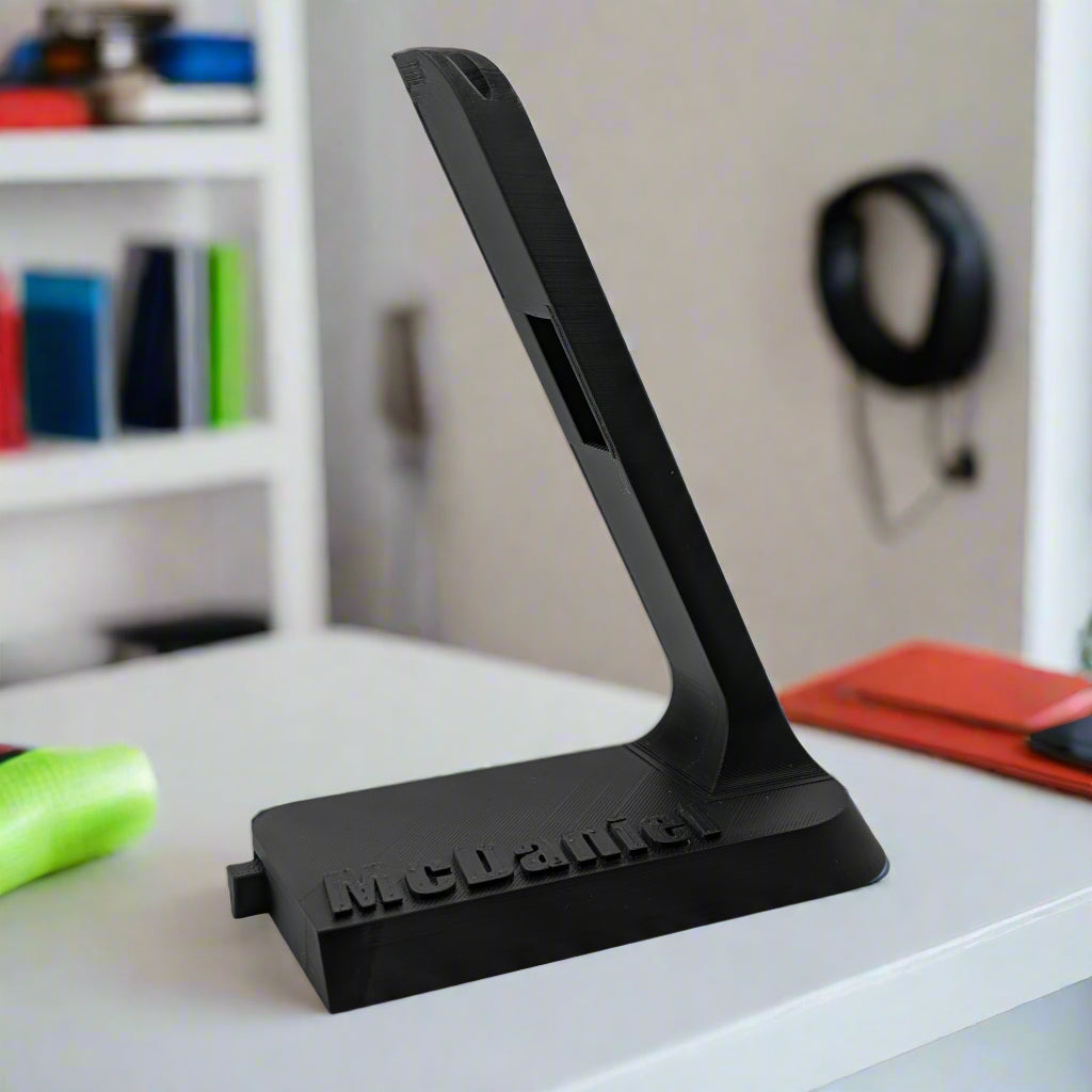 Personalized Shokz headphone charging stand.