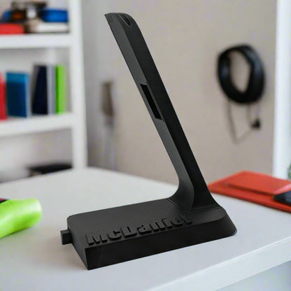 Personalized Shokz headphone charging stand.