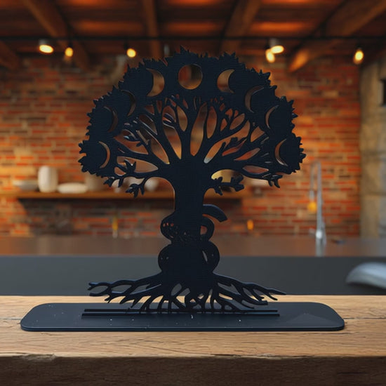 Modern Tree of Life tabletop art with moon phase cutouts, featured in cozy exposed-brick kitchen interior with warm lighting